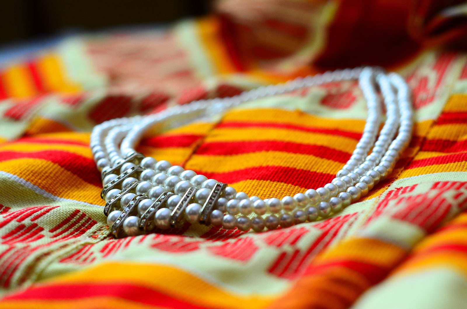 Colorful seed beads spread out on a table