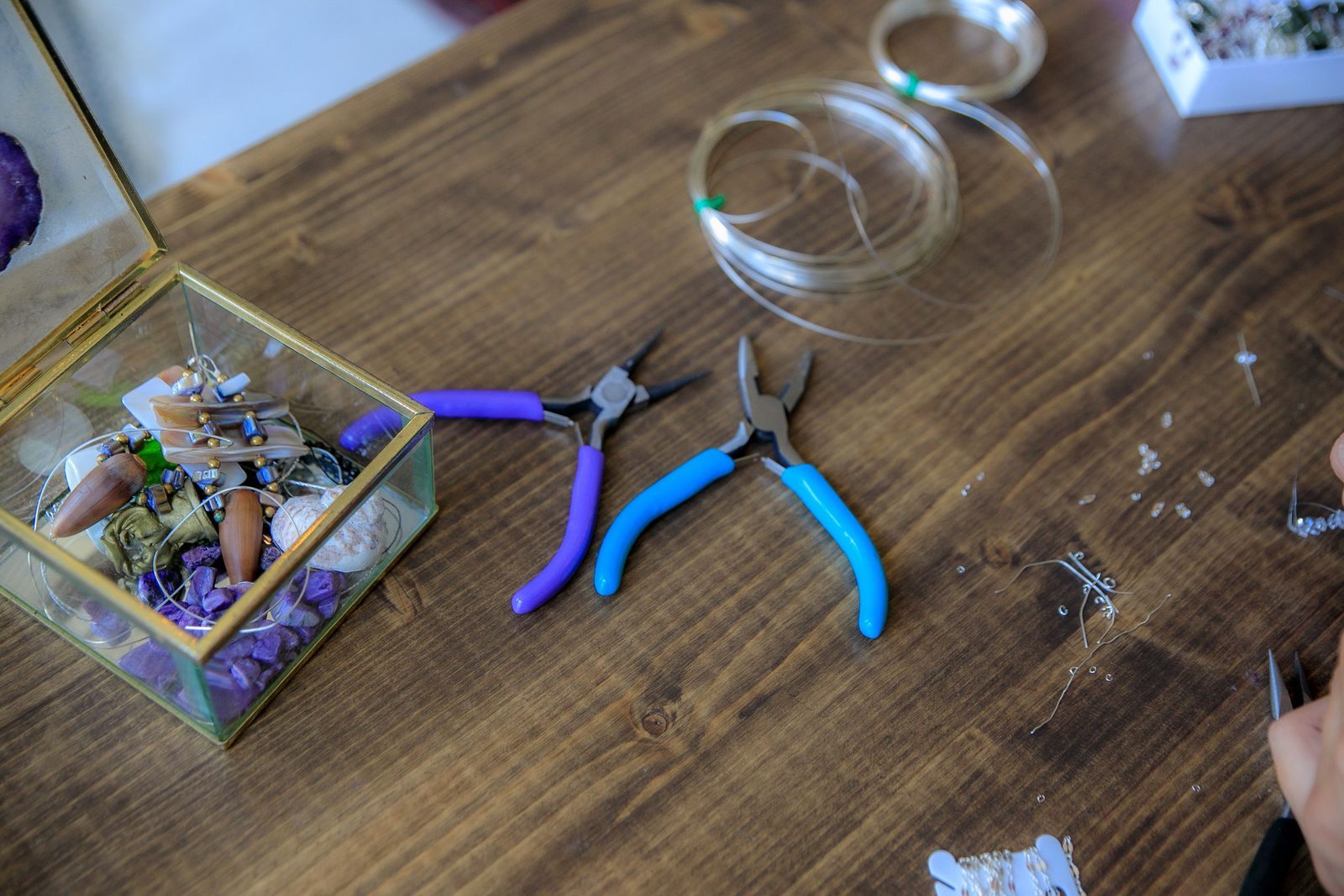 Seed beads spilled on a crafting table